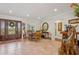 Inviting entryway with beautiful tile flooring, detailed wood door, and decor at 206 Corbett St, Belleair, FL 33756