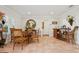 Cozy entryway features a table, chairs, wine bar, and a round mirror at 206 Corbett St, Belleair, FL 33756
