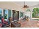 Inviting front porch with seating, tiled floors, and decorative accents, perfect for relaxing outdoors at 206 Corbett St, Belleair, FL 33756