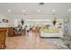 Open living area with neutral tones, dining area, and elegant decor, perfect for entertaining guests at 206 Corbett St, Belleair, FL 33756