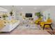 Stylish living room featuring a modern sofa, bright accents, and contemporary decor for comfortable living at 206 Corbett St, Belleair, FL 33756