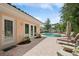 View of a swimming pool surrounded by patio and lush landscaping, perfect for relaxation and entertaining at 206 Corbett St, Belleair, FL 33756