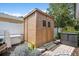 Wooden shed with steps, offering extra storage space and potential for a workshop or hobby area at 206 Corbett St, Belleair, FL 33756