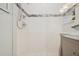 Modern tiled shower with glass enclosure and marble counter at 206 Corbett St, Belleair, FL 33756