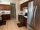 Well-equipped kitchen with stainless steel appliances, ample counter space, and wooden cabinets at 2154 Briarway Dr, Clearwater, FL 33763