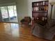 Relaxing living area with hardwood floors, sliding glass doors, and comfortable seating at 2154 Briarway Dr, Clearwater, FL 33763