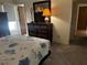 Comfortable main bedroom with neutral carpet, a dresser, and ample closet space at 2154 Briarway Dr, Clearwater, FL 33763
