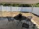 Covered back porch featuring an outdoor dining set, perfect for relaxing or entertaining at 2205 N Grady Ave, Tampa, FL 33607