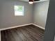 Cozy room featuring wood-look floors, natural light and neutral paint at 2205 N Grady Ave, Tampa, FL 33607