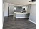Modern kitchen featuring white cabinets, black hardware, and stainless steel appliances at 2205 N Grady Ave, Tampa, FL 33607