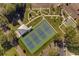 Aerial view showcasing tennis courts and park-like setting with walkways and benches at 2231 Utopian E Dr # 117, Clearwater, FL 33763