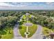 A high aerial view of the long park and gardens leading to the community entrance at 2231 Utopian E Dr # 117, Clearwater, FL 33763