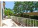 Back patio offers privacy and relaxation within a landscaped environment at 2231 Utopian E Dr # 117, Clearwater, FL 33763