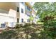 Spacious backyard with tropical landscaping offering a serene outdoor retreat at 2231 Utopian E Dr # 117, Clearwater, FL 33763
