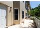 The exterior of the building with two windows and a patio at 2231 Utopian E Dr # 117, Clearwater, FL 33763