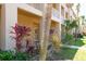 Inviting ground-floor unit with well-maintained landscaping and exterior features at 2231 Utopian E Dr # 117, Clearwater, FL 33763