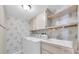 Functional laundry room featuring washer, dryer, sink and ample storage space at 2231 Utopian E Dr # 117, Clearwater, FL 33763