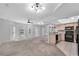 Bright living area featuring an open floor plan with plush carpeting and a modern kitchen at 2231 Utopian E Dr # 117, Clearwater, FL 33763