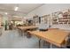 Large, well-lit workshop with workbenches, woodworking tools, and storage at 2231 Utopian E Dr # 117, Clearwater, FL 33763