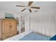Bedroom featuring a ceiling fan and closet with light-colored walls and accents at 2506 Laurelwood Dr # 4C, Clearwater, FL 33763