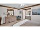 Bedroom featuring a dresser, adjacent bath, ceiling fan, and tile floors at 2506 Laurelwood Dr # 4C, Clearwater, FL 33763