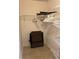 Walk-in closet with metal shelving and hanging space for optimal organization at 2506 Laurelwood Dr # 4C, Clearwater, FL 33763