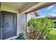 Cozy condo entryway with a covered porch and lush greenery at 2506 Laurelwood Dr # 4C, Clearwater, FL 33763