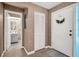 Foyer featuring a tiled floor, closet, and neutral colored walls at 2506 Laurelwood Dr # 4C, Clearwater, FL 33763