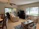 Comfortable living room with ample seating, natural light and contemporary design for relaxation at 2506 Laurelwood Dr # 4C, Clearwater, FL 33763