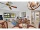 Inviting living room with tile floors, comfortable seating, and a view to the outside at 2506 Laurelwood Dr # 4C, Clearwater, FL 33763