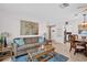 Comfortable living room with sofa, coffee table, and dining set at 2506 Laurelwood Dr # 4C, Clearwater, FL 33763