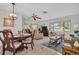 Open-concept living area boasting plenty of natural light from the many windows, and an adjacent dining area at 2506 Laurelwood Dr # 4C, Clearwater, FL 33763