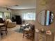 Inviting living room featuring tile flooring, comfortable seating, and large windows for natural light at 2506 Laurelwood Dr # 4C, Clearwater, FL 33763