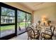 Covered patio area with seating, offering views of the landscaped backyard at 2506 Laurelwood Dr # 4C, Clearwater, FL 33763