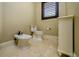 Elegant bathroom featuring a bidet, toilet, and stylish cream-colored vanity at 2680 Keystone Springs Rd, Tarpon Springs, FL 34688