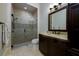 Elegant bathroom featuring glass-enclosed shower and granite countertop vanity at 2680 Keystone Springs Rd, Tarpon Springs, FL 34688