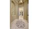 An elegantly designed hallway features decorative tile and arched doorways, enhancing the home's aesthetic at 2680 Keystone Springs Rd, Tarpon Springs, FL 34688