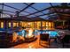 Outdoor pool features a spa, waterfall, fire pit and screened-in lanai at 2680 Keystone Springs Rd, Tarpon Springs, FL 34688