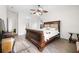 Serene main bedroom with wood floors, ceiling fan, and a spacious layout at 27338 Hollybrook Trl, Wesley Chapel, FL 33544