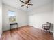 Bright bedroom with wood floors, a closet, and a window providing natural light at 27338 Hollybrook Trl, Wesley Chapel, FL 33544