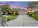 Well-maintained single-Gathering home with mature landscaping and a spacious driveway at 27338 Hollybrook Trl, Wesley Chapel, FL 33544