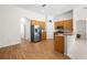 Bright, open kitchen featuring wood floors, stainless steel appliances, and a functional layout at 27338 Hollybrook Trl, Wesley Chapel, FL 33544