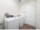 Convenient laundry room equipped with modern washer and dryer units at 27338 Hollybrook Trl, Wesley Chapel, FL 33544