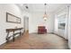 Open living area featuring elegant décor, wood floors, and bright natural lighting at 27338 Hollybrook Trl, Wesley Chapel, FL 33544