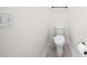 Clean, white toilet with bidet attachment in a well-lit, simple bathroom setting at 27338 Hollybrook Trl, Wesley Chapel, FL 33544