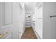Spacious walk-in closet with ample shelving and hanging space for organized storage at 27338 Hollybrook Trl, Wesley Chapel, FL 33544
