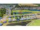 Beautiful aerial view of a well-maintained community with lush landscaping, a golf course, and several ponds at 29432 Coharie Loop, San Antonio, FL 33576