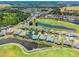 Beautiful aerial view of a well-maintained community with lush landscaping, a golf course, and several ponds at 29432 Coharie Loop, San Antonio, FL 33576