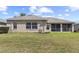 The backyard has a well maintained lawn and an enclosed patio at 29432 Coharie Loop, San Antonio, FL 33576