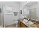Bathroom featuring a single sink vanity with tile floors and tub/shower at 29432 Coharie Loop, San Antonio, FL 33576